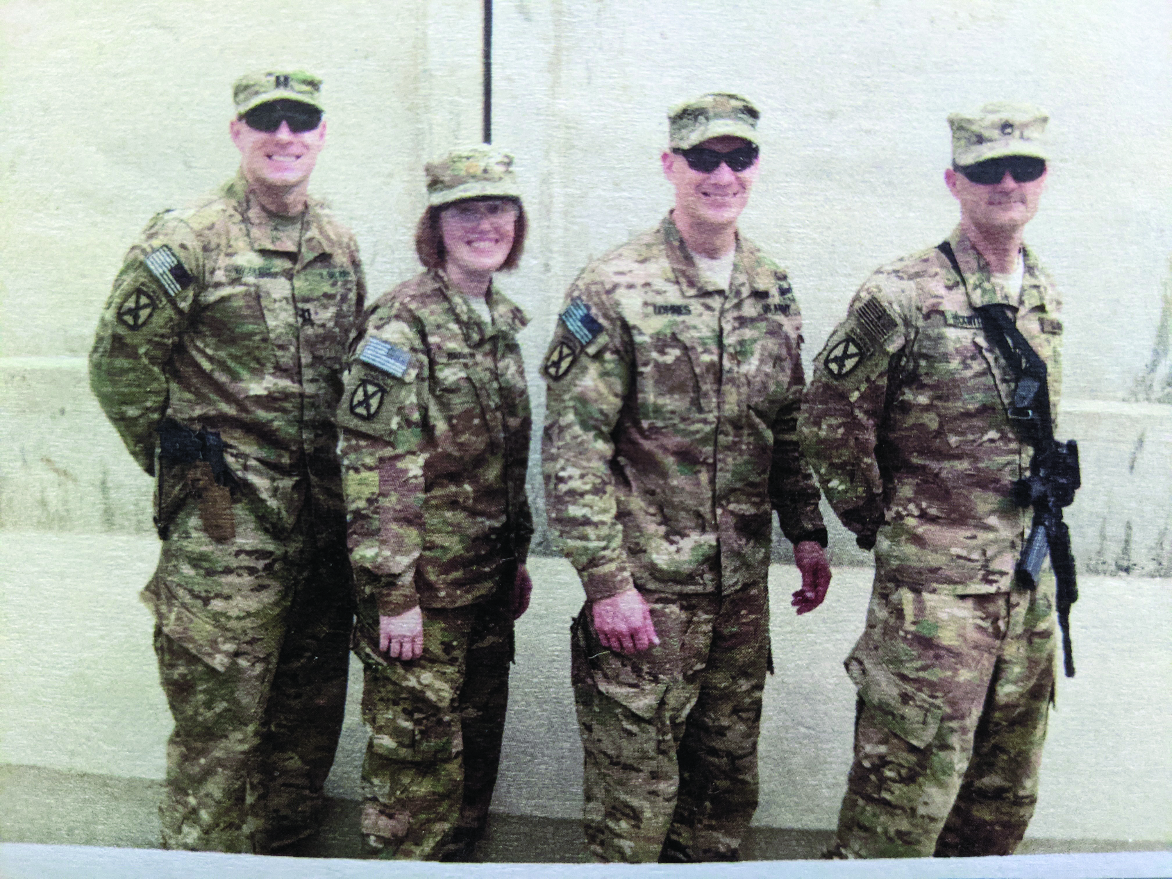 Members of the Train Advise Assist–East legal
        team pose for a group photo at Tactical Base
        Gamberi, Afghanistan. Pictured left to right: CPT
        John McGuire, MAJ Sandra Brannom, then-MAJ
        Brian Lohnes, then-SSG Tim Beckwith. (Photo
        courtesy of SFC Beckwith)